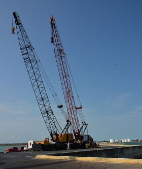 cranes used to move containers at the Port of Belize – Best Places In The World To Retire – International Living